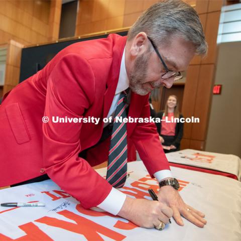 Chancellor Ronnie Green signs one of the four Alumni N150 flags. The flags will travel around the world to various alumni chapters and be signed. They will return in the fall and be hung for homecoming weekend for all to see. Everyone was invited to enjoy a cupcake and join in the festivities with their Husker friends at the Wick Alumni Center, Friday February 15th. The Nebraska Charter was available to view, along with other historical items. Copies of Dear Old Nebraska U could be purchased and signed. Charter Day at the Wick Alumni. February 15th, 2019. Photo by Gregory Nathan / University Communication.